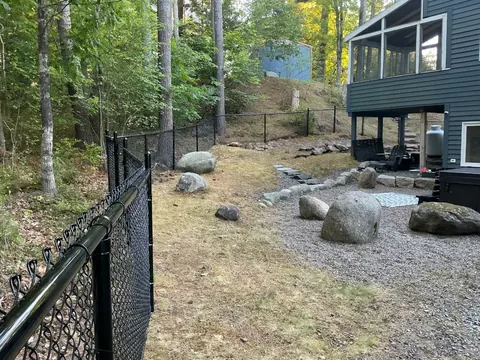 Black chain-link fence with posts and mesh