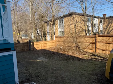 Wood privacy fence along a yard