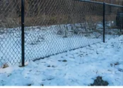 Chain-link fence in winter conditions