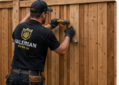 Valerian Fence worker repairing a wood fence